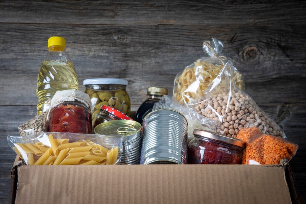 Volunteer with box of food for poor . Ramazan kolisi . Donation concept